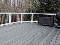 <b>TimberTech Azek Island Oak Decking with White Lincoln Vinyl railing with continuous Cocktail Rail and Eye Ball Lights in Posts</b>